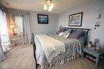 Beautifully decorated bedroom with a lakeview